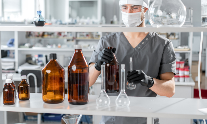 Scientist mixing chemicals